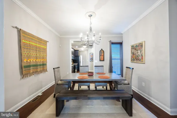 a view of a dining room with furniture and window