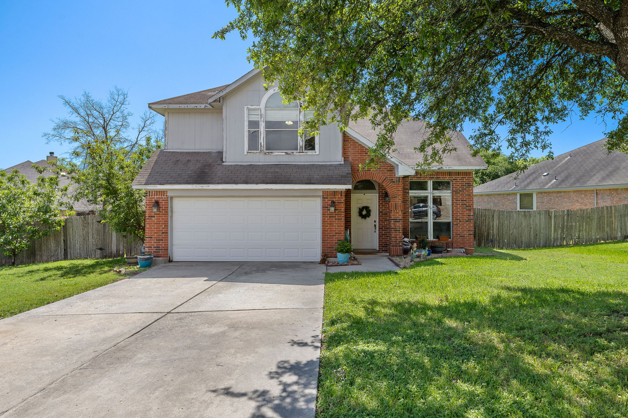 615 Runners Ridge Pflugerville, TX 78660 - Photo 1 of 32 a front view of a house with a yard and garage