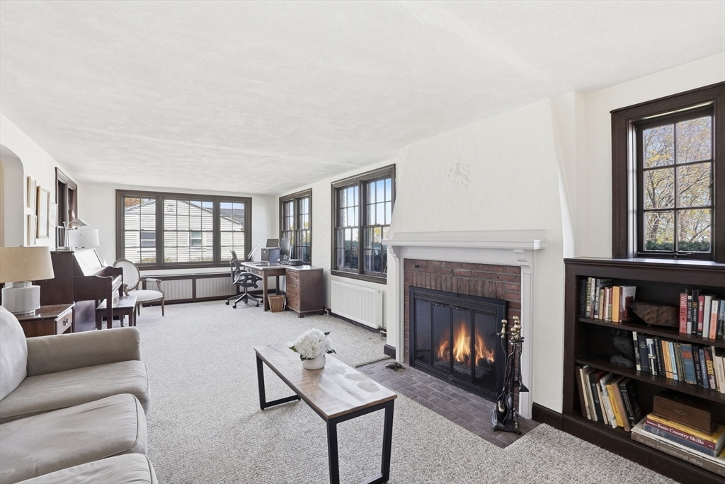 34 Governor Long Road Hingham, MA 02043 - Photo 8 of 37 a living room with furniture and a fireplace