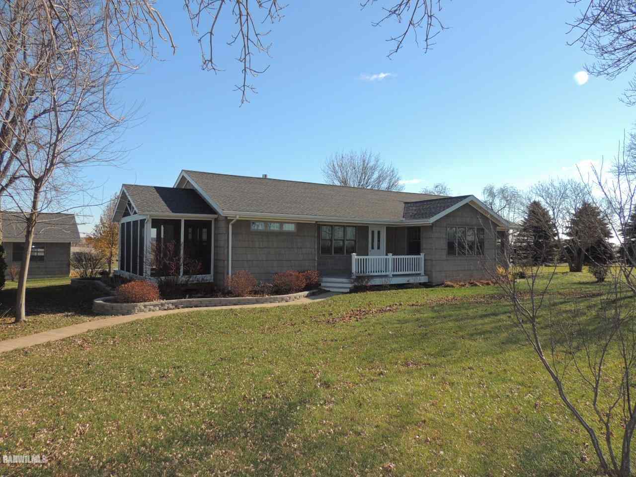 2285 South Massbach Road Stockton, IL 61085 - Photo 1 of 25 a front view of house with yard and trees in the background