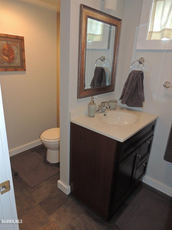 2285 South Massbach Road Stockton, IL 61085 - Photo 14 of 25 a bathroom with a sink vanity and a toilet