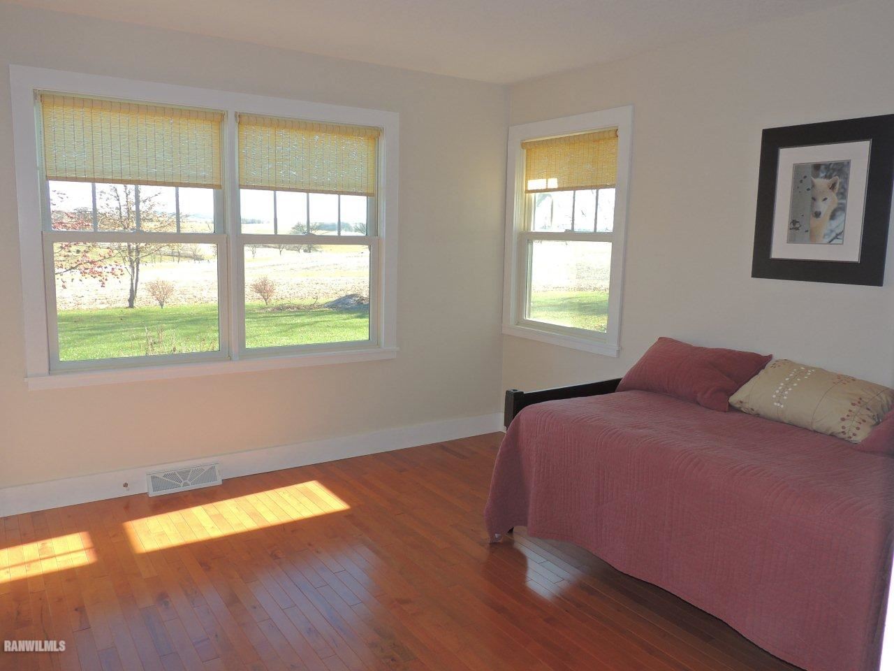 2285 South Massbach Road Stockton, IL 61085 - Photo 16 of 25 a bedroom with a bed and a window