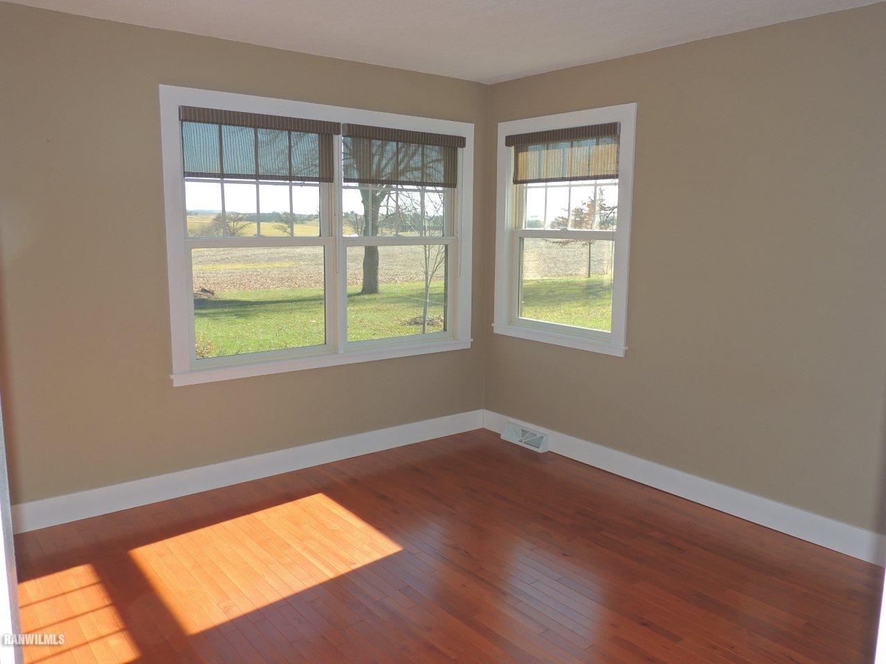 2285 South Massbach Road Stockton, IL 61085 - Photo 17 of 25 an empty room with wooden floor and windows