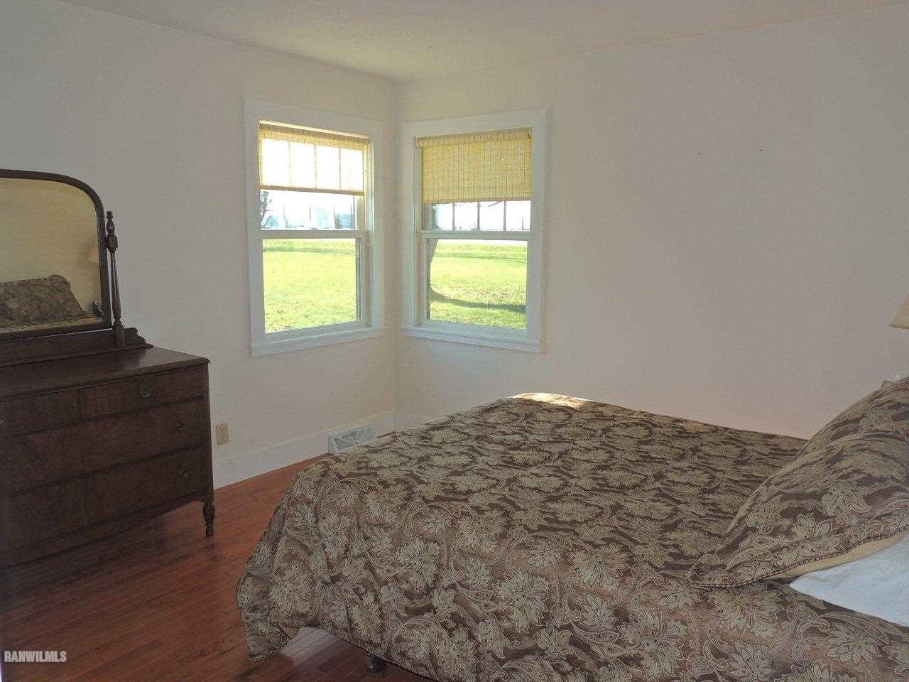 2285 South Massbach Road Stockton, IL 61085 - Photo 18 of 25 a bedroom with a bed and a dresser