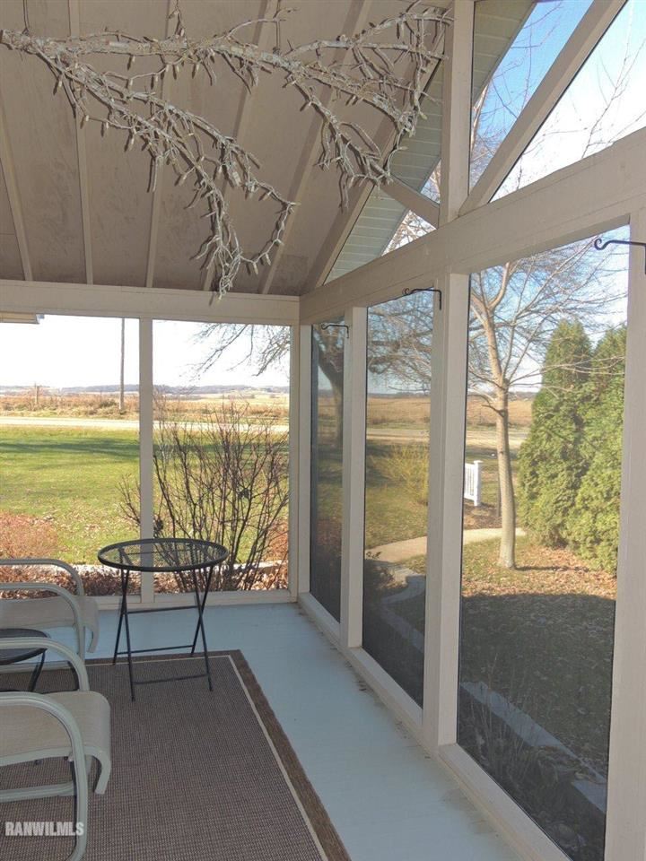 2285 South Massbach Road Stockton, IL 61085 - Photo 19 of 25 a living room with furniture and a floor to ceiling window