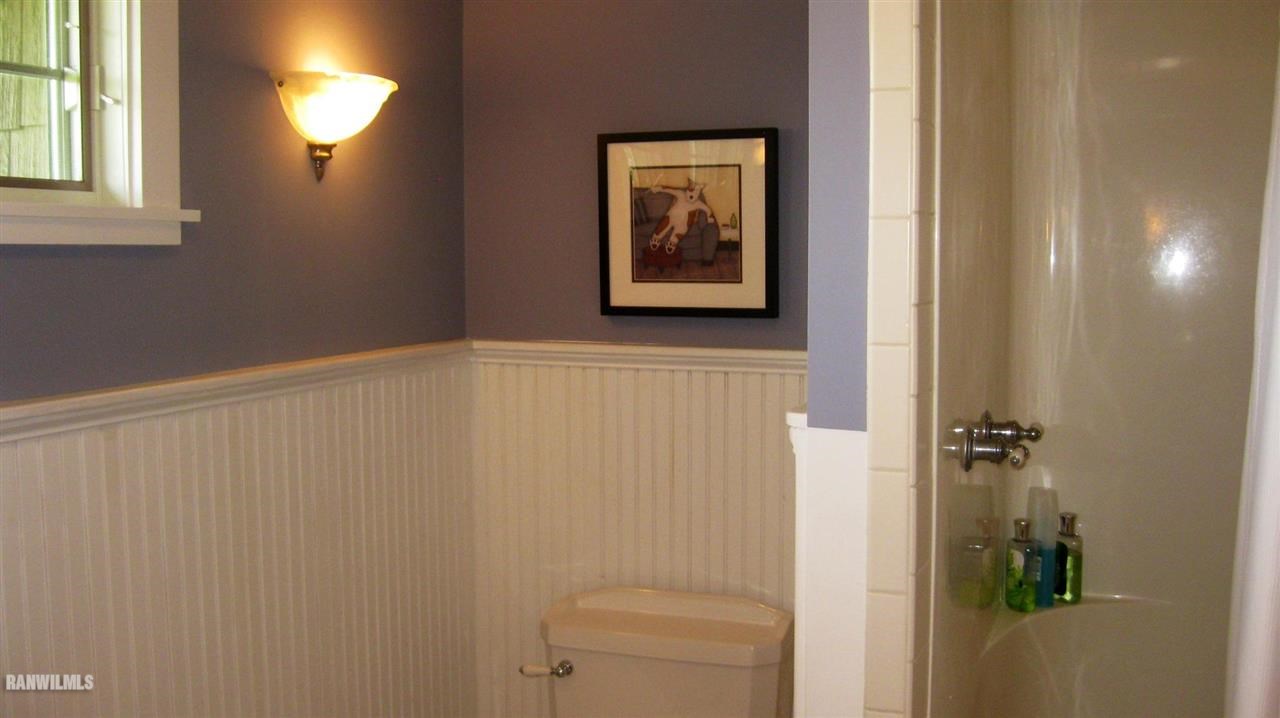 2285 South Massbach Road Stockton, IL 61085 - Photo 25 of 25 a bathroom with a shower curtain and a window