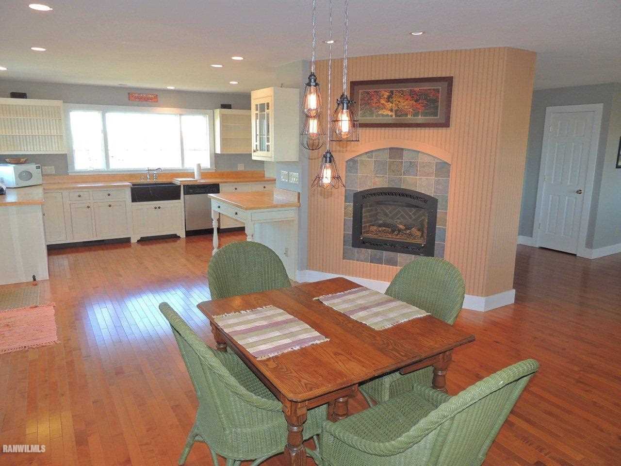 2285 South Massbach Road Stockton, IL 61085 - Photo 3 of 25 a living room with furniture and a fireplace