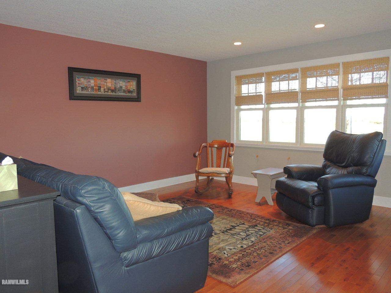 2285 South Massbach Road Stockton, IL 61085 - Photo 6 of 25 a living room with furniture and a large window