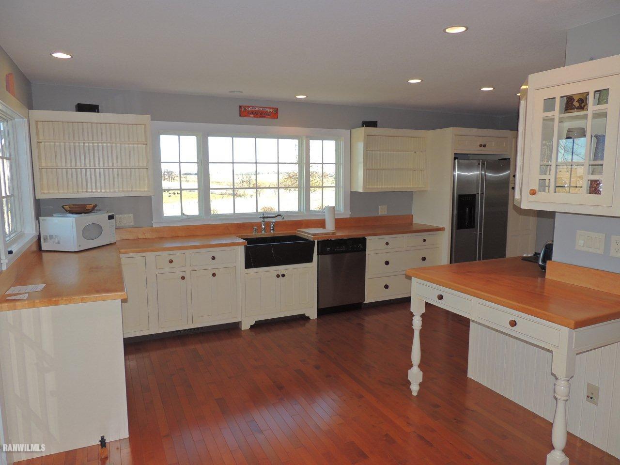 2285 South Massbach Road Stockton, IL 61085 - Photo 7 of 25 a kitchen with stainless steel appliances granite countertop a sink a stove and a refrigerator