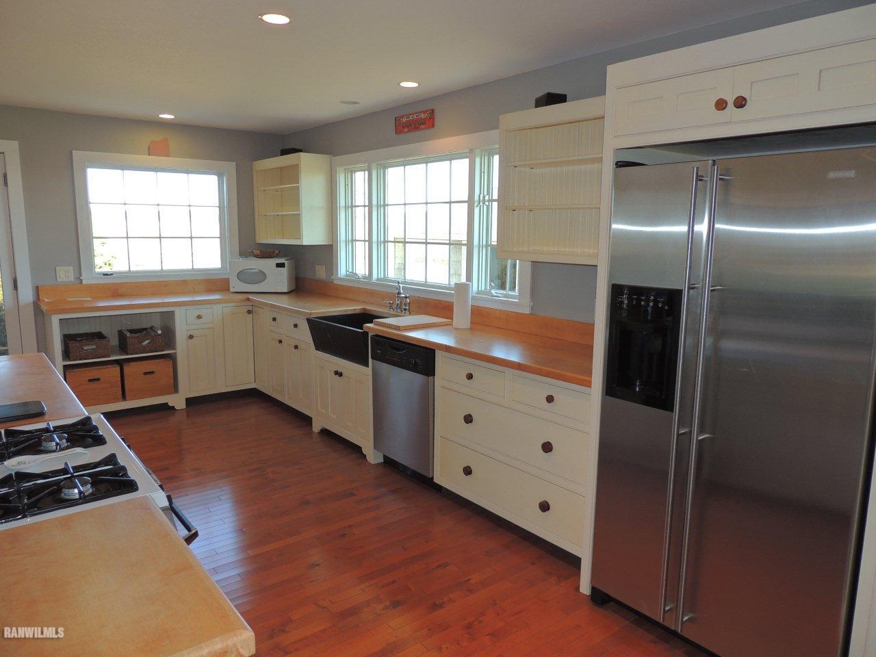 2285 South Massbach Road Stockton, IL 61085 - Photo 8 of 25 a kitchen with a stove a refrigerator and windows