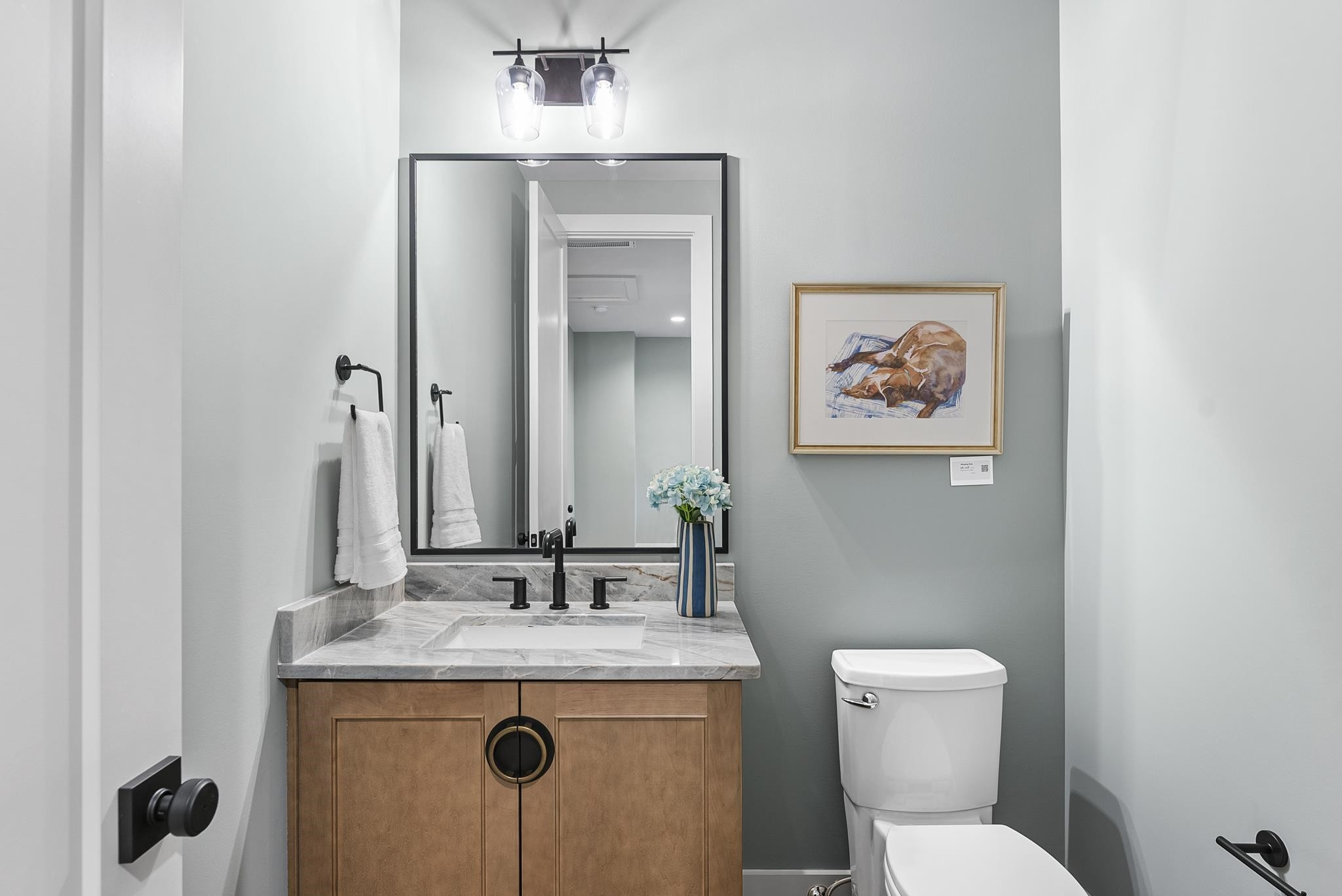 2312 Airline Drive Raleigh, NC 27607 - Photo 40 of 54 a bathroom with a granite countertop toilet sink and mirror