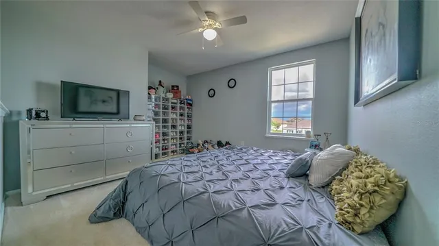 a bathroom with a sink vanity mirror and toilet