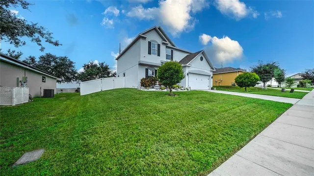 a front view of house with a garden