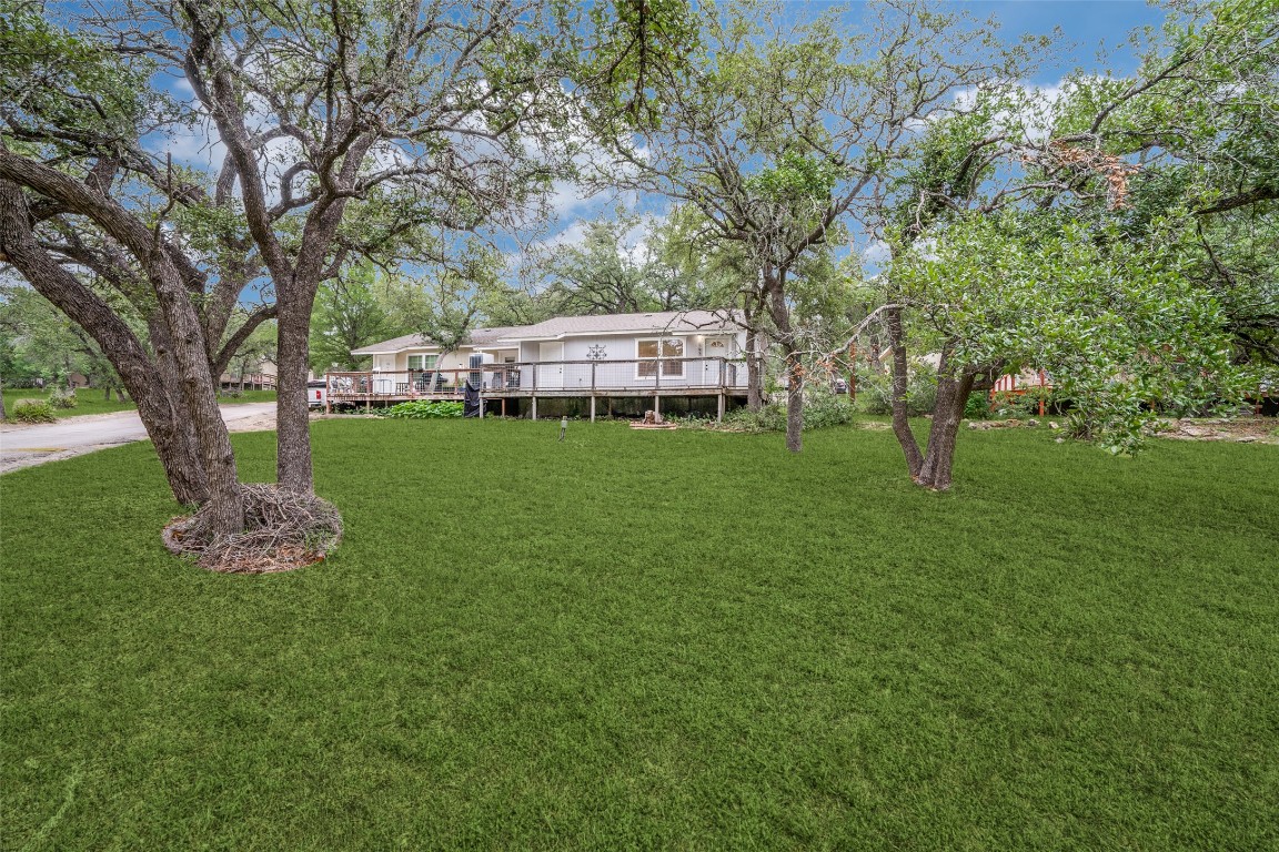 23393 Nameless Road, Unit 143 Leander, TX 78641 - Photo 1 of 1 a view of a house with a backyard porch and sitting area