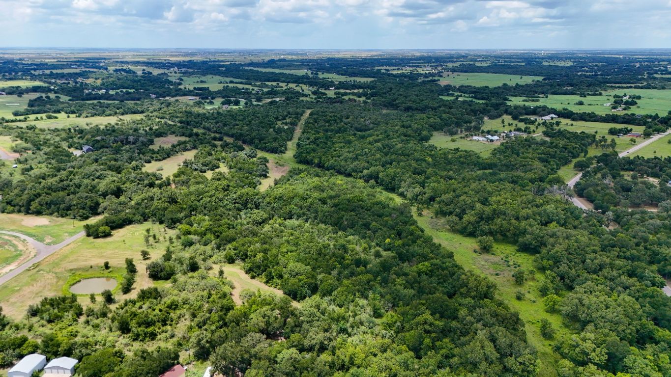 3000 Tract 1 Elgin, TX 78621 - Photo 14 of 18 an aerial view of residential houses with outdoor space and trees