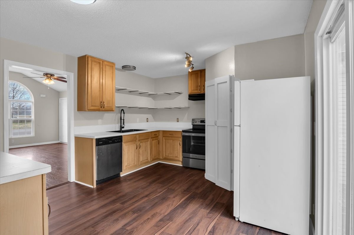 2765 Windwalker Court Murfreesboro, TN 37128 - Photo 12 of 31 a kitchen with a refrigerator and a stove top oven
