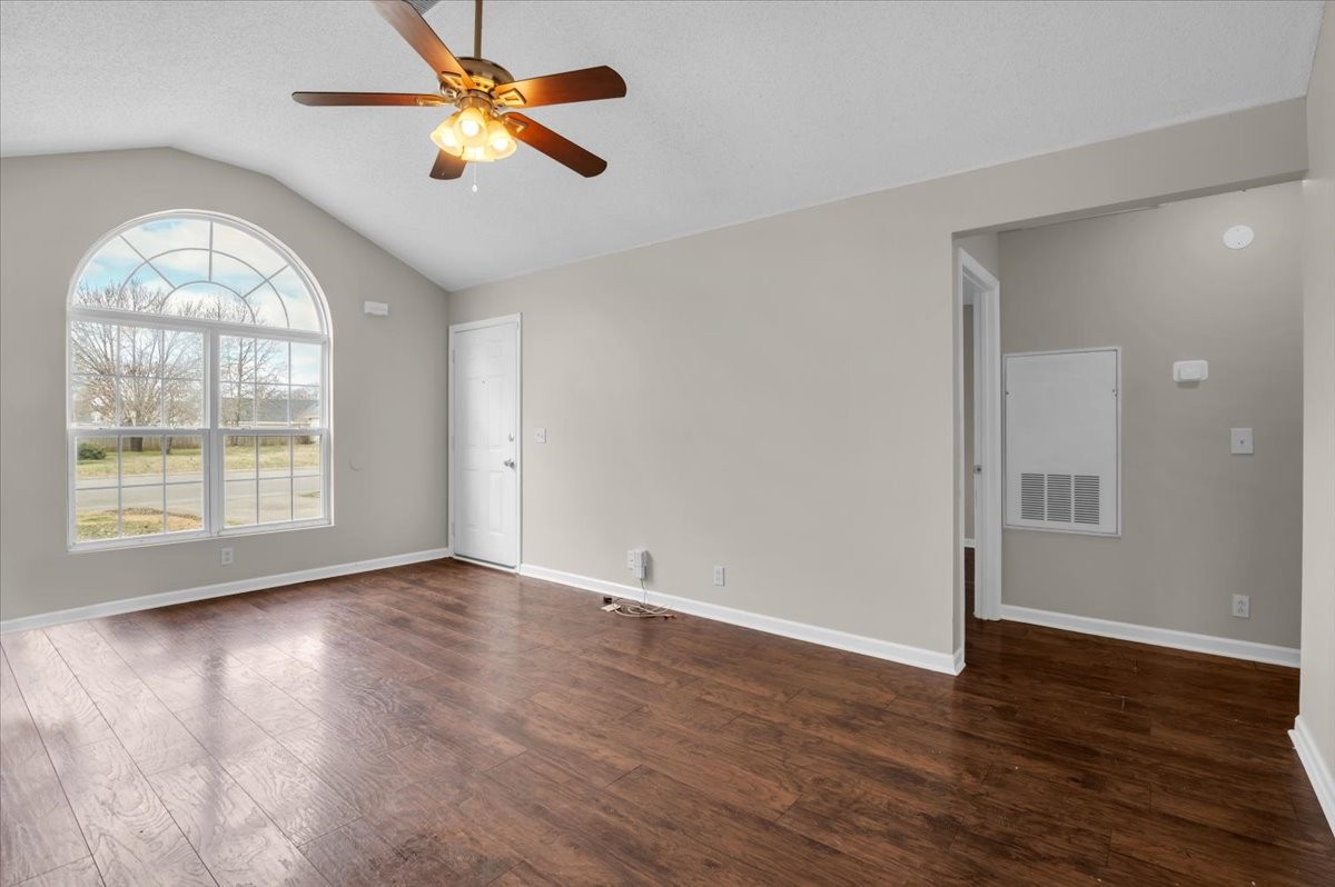 2765 Windwalker Court Murfreesboro, TN 37128 - Photo 2 of 31 an empty room with wooden floor fan and windows