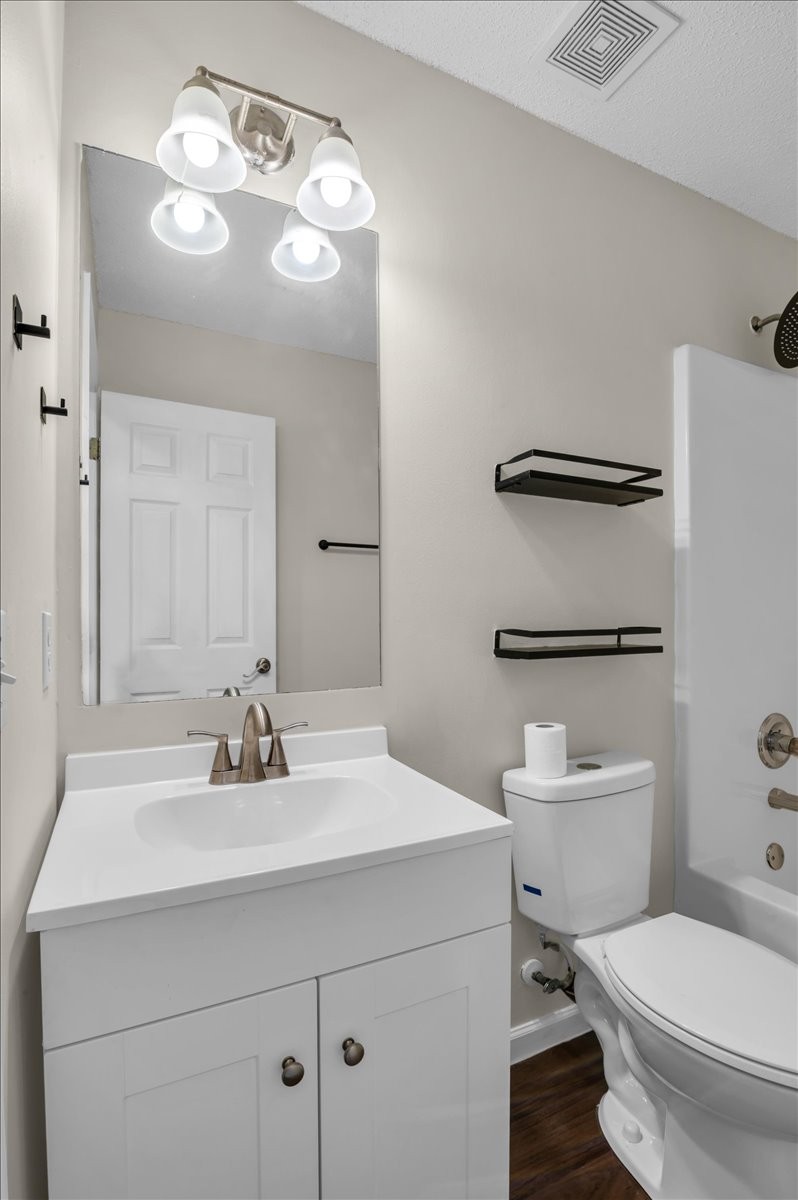 2765 Windwalker Court Murfreesboro, TN 37128 - Photo 23 of 31 a bathroom with a sink vanity mirror and toilet