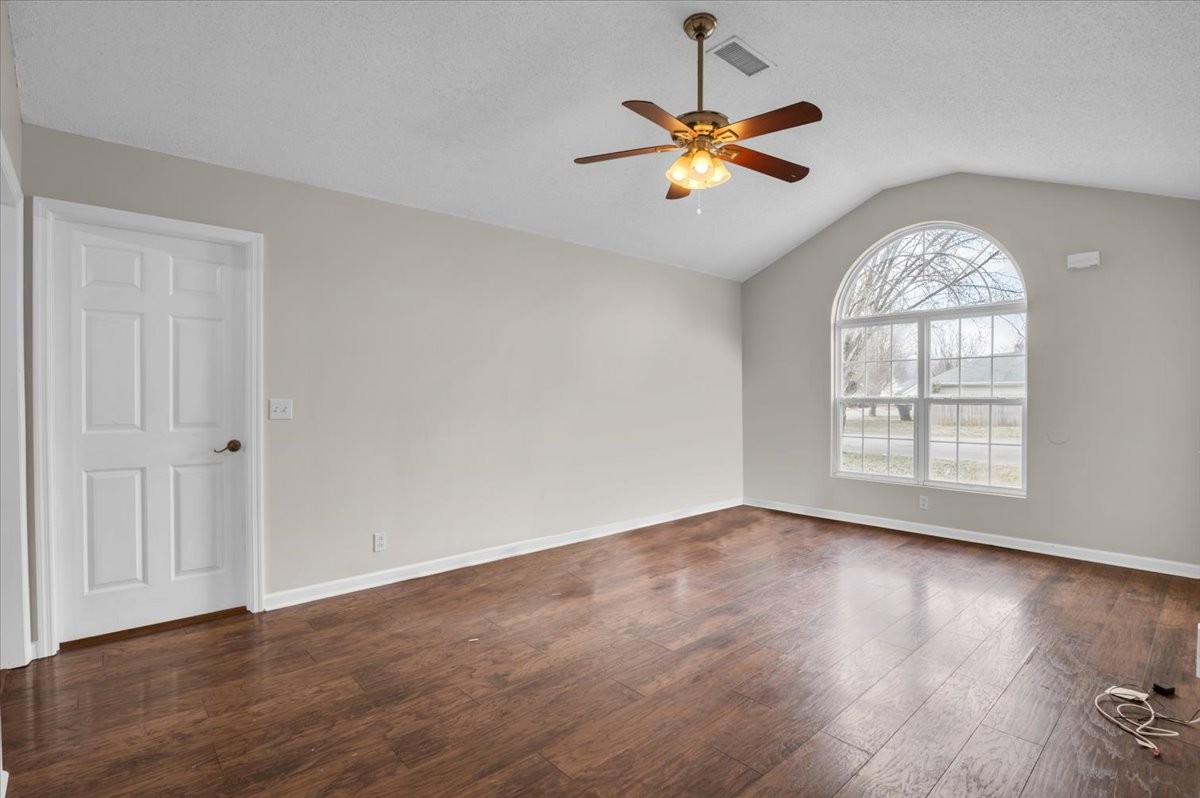 2765 Windwalker Court Murfreesboro, TN 37128 - Photo 3 of 31 a view of an empty room with wooden floor and a window