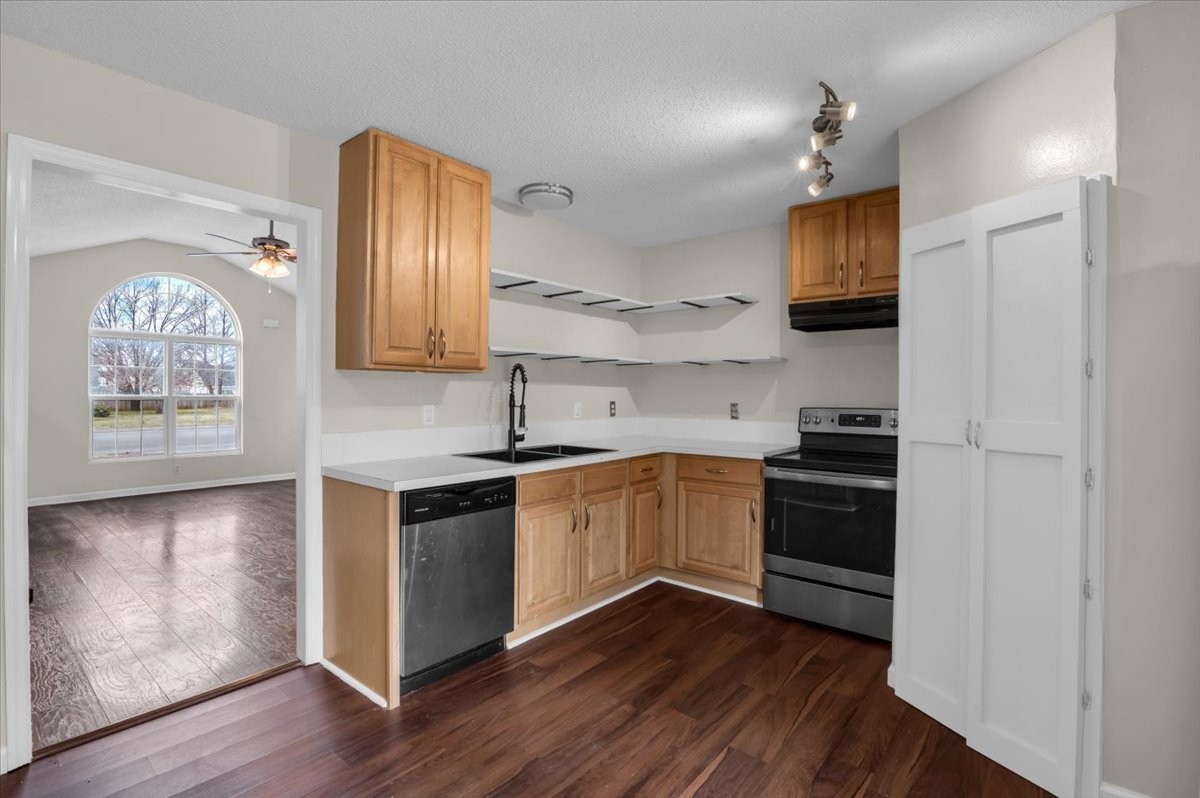 2765 Windwalker Court Murfreesboro, TN 37128 - Photo 6 of 31 a kitchen with stainless steel appliances granite countertop a stove a sink and a refrigerator