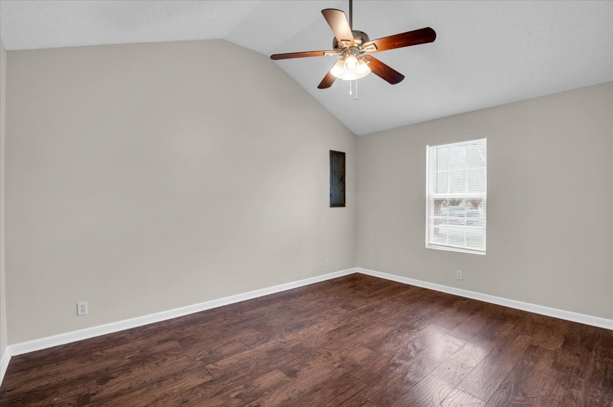 2765 Windwalker Court Murfreesboro, TN 37128 - Photo 7 of 31 an empty room with wooden floor fan and windows