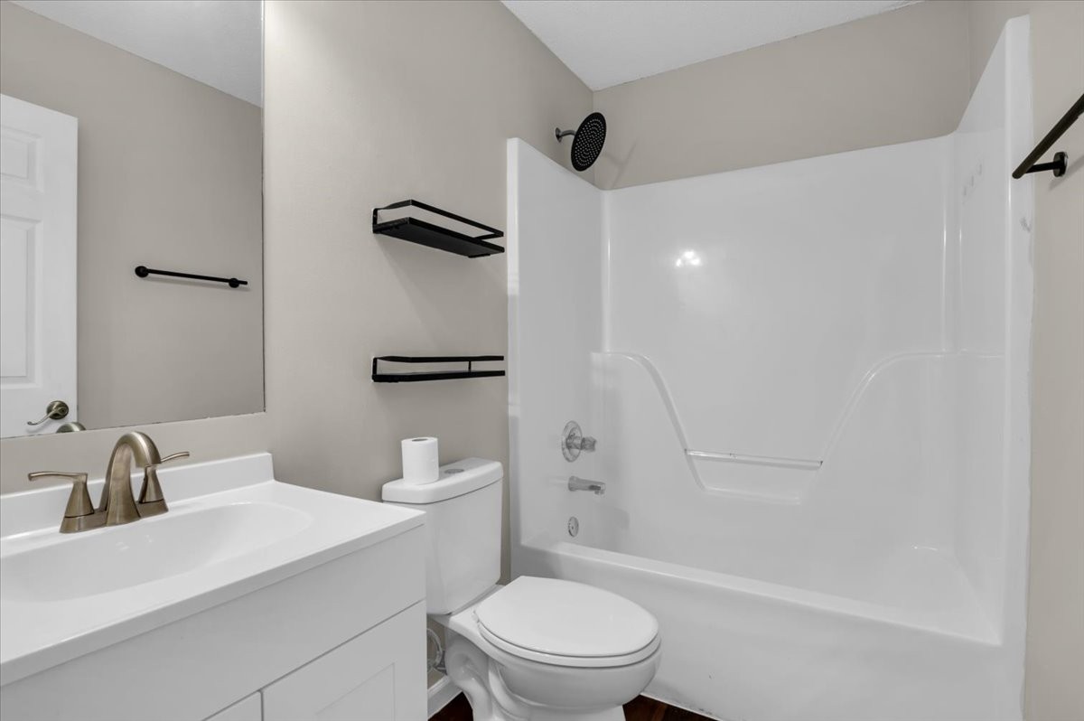 2765 Windwalker Court Murfreesboro, TN 37128 - Photo 8 of 31 a white toilet sitting next to a bathroom sink