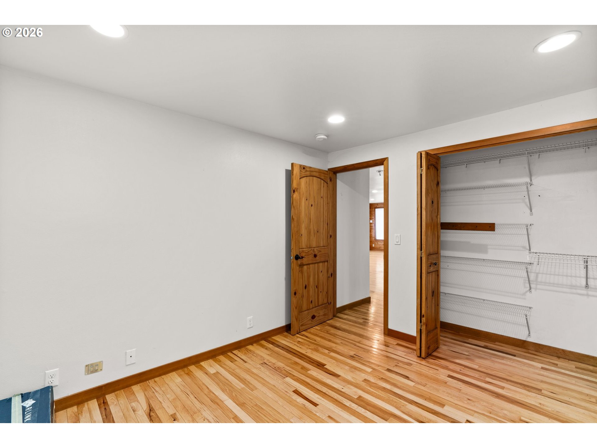 7470 Maple Creek Road Westlake, OR 97493 - Photo 14 of 33 a view of an empty room and wooden floor