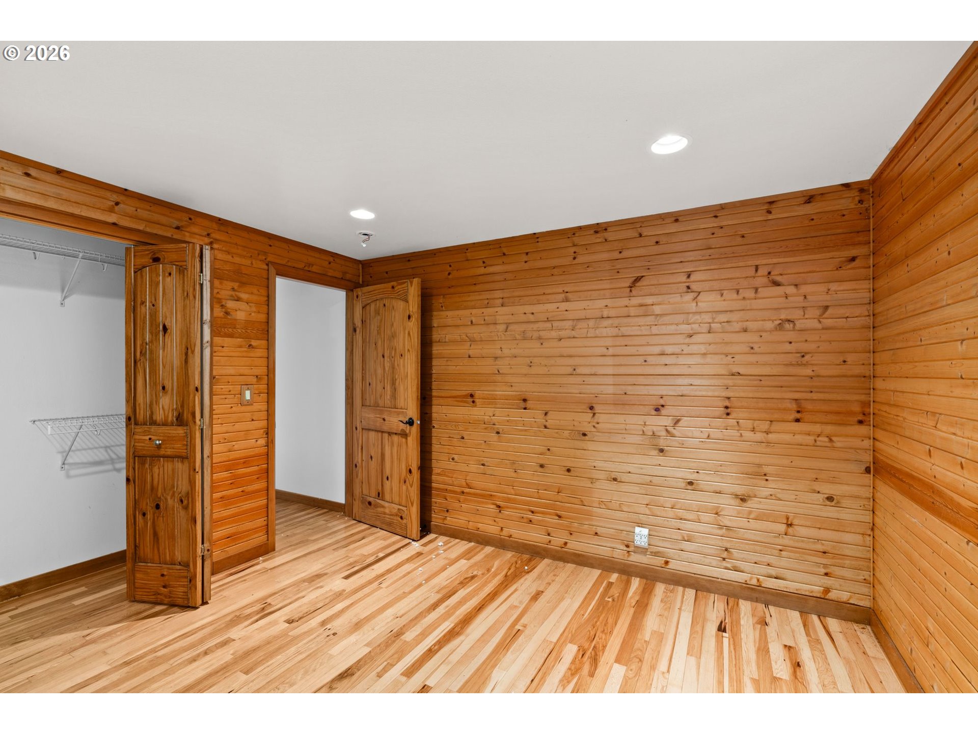 7470 Maple Creek Road Westlake, OR 97493 - Photo 16 of 33 a view of an empty room and wooden floor