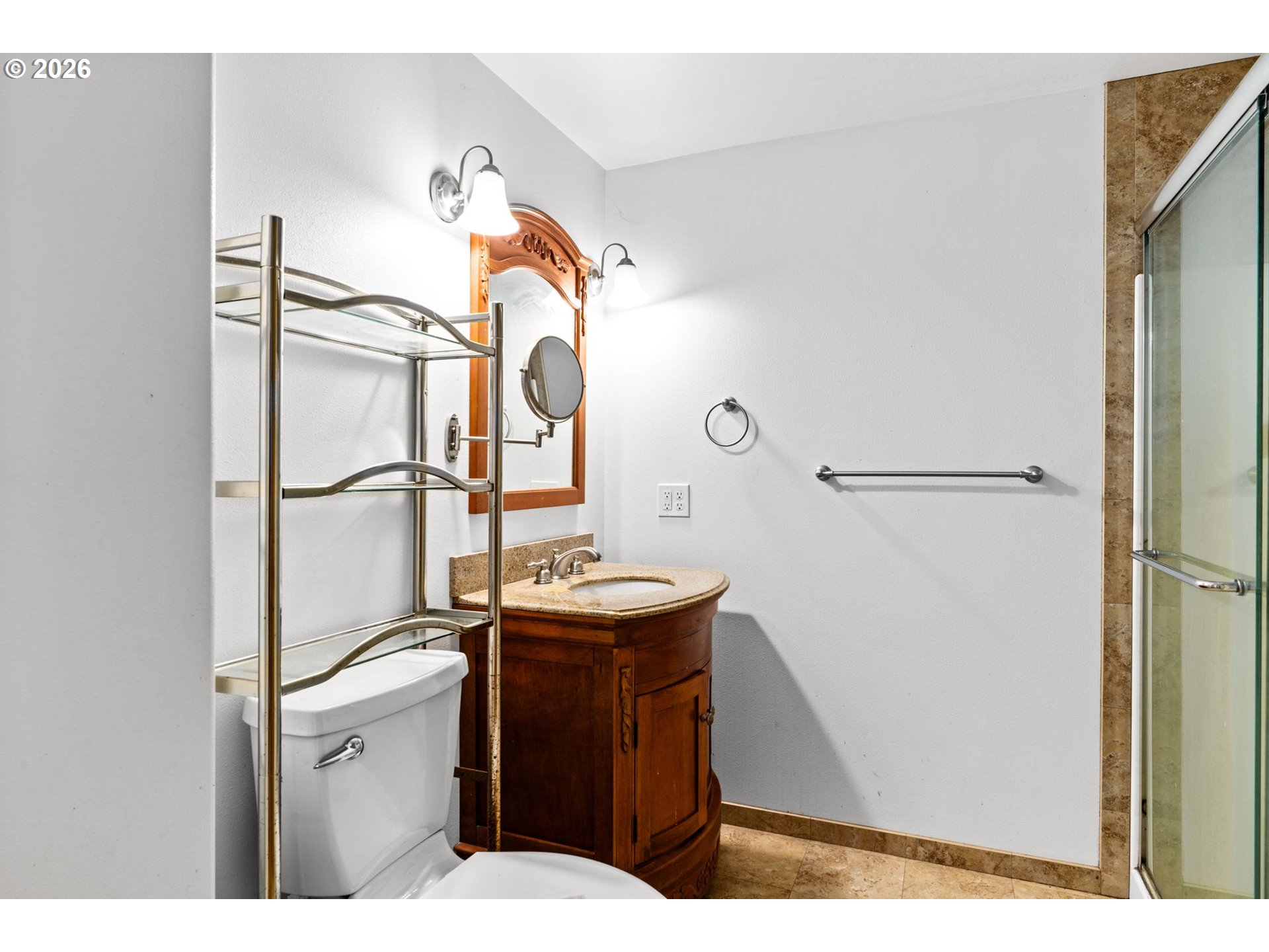 7470 Maple Creek Road Westlake, OR 97493 - Photo 17 of 33 a bathroom with a sink a toilet and shower