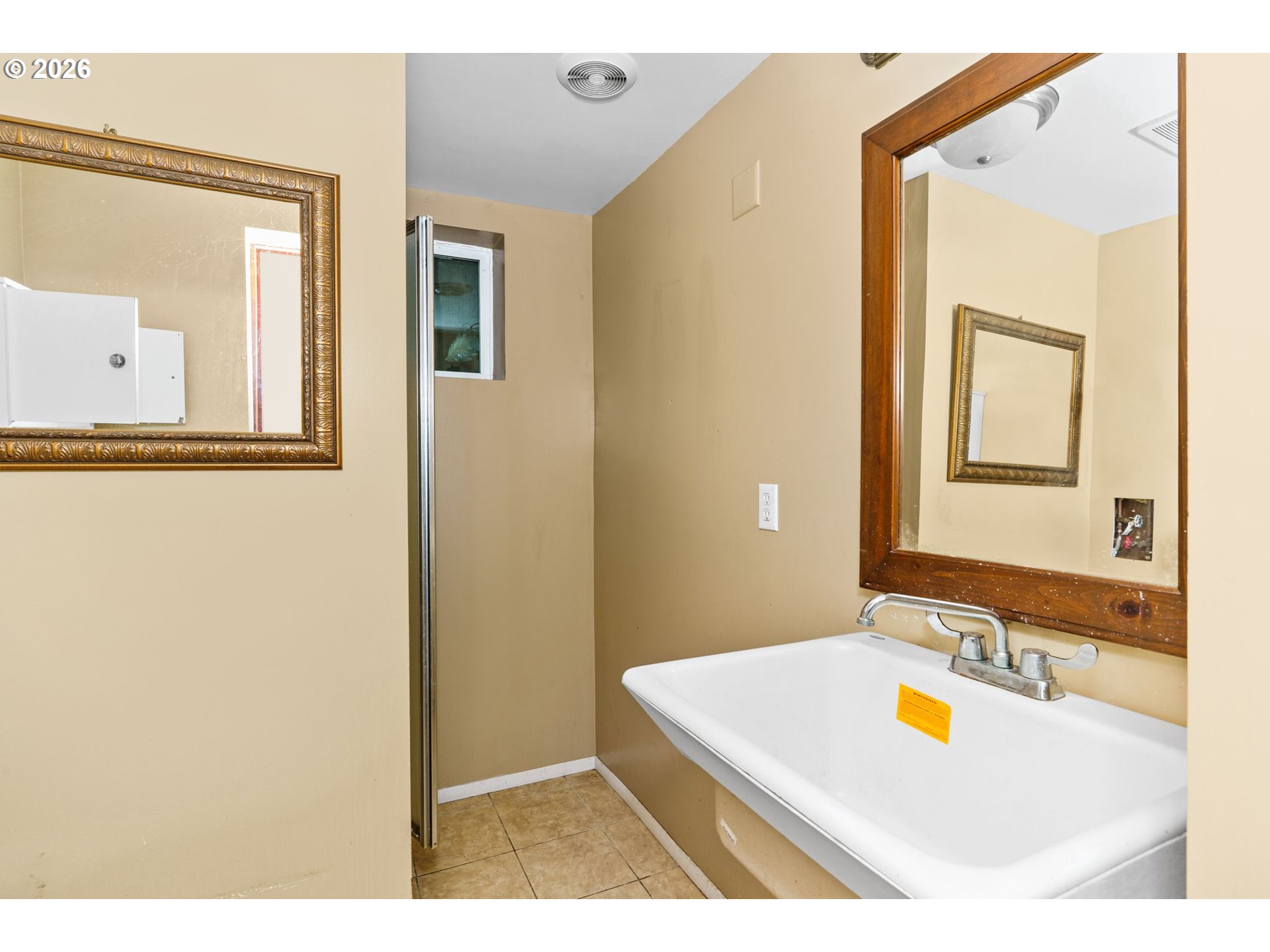 7470 Maple Creek Road Westlake, OR 97493 - Photo 20 of 33 a bathroom with a tub sink and mirror