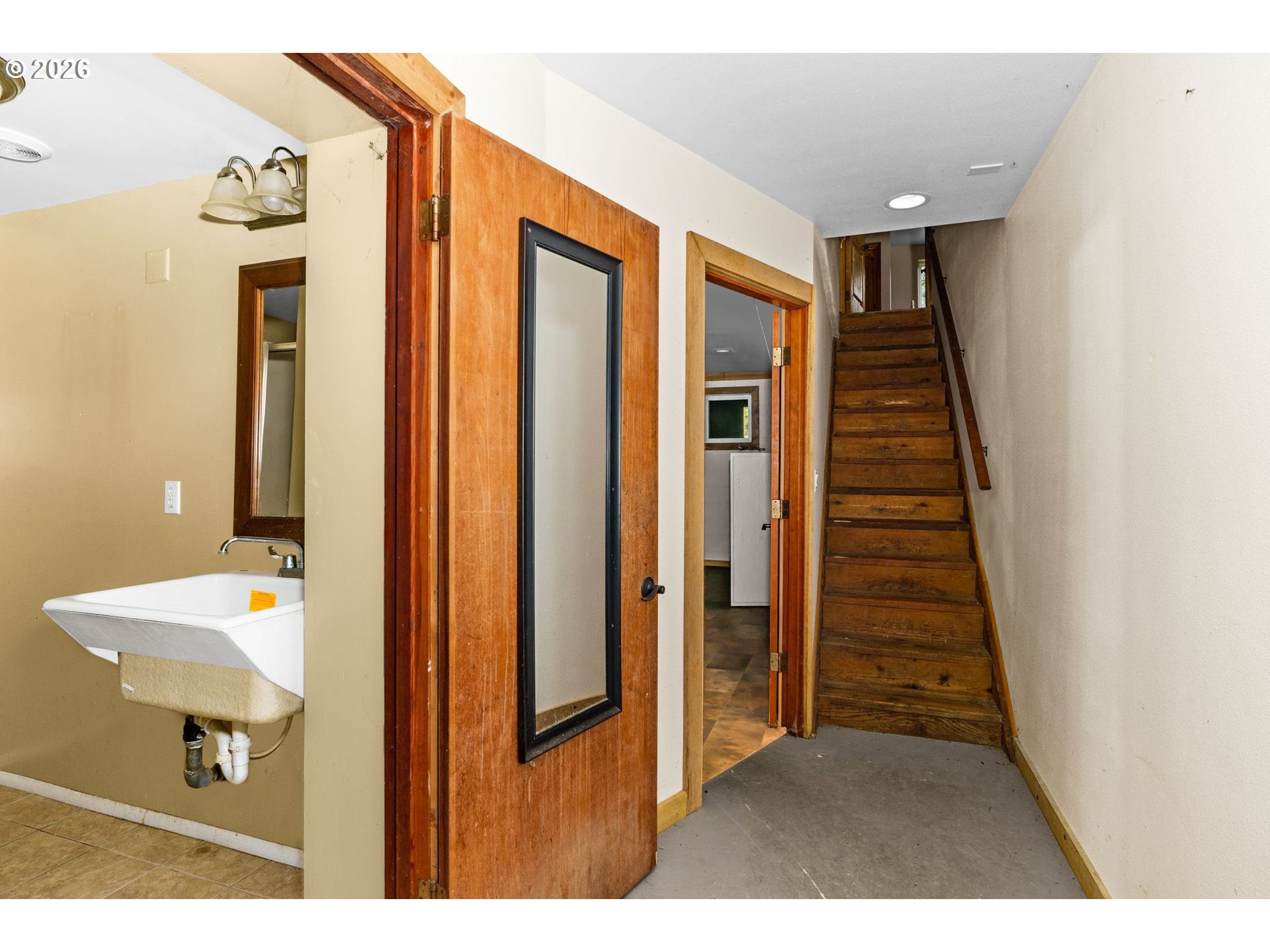 7470 Maple Creek Road Westlake, OR 97493 - Photo 22 of 33 a view of a hallway with wooden floor