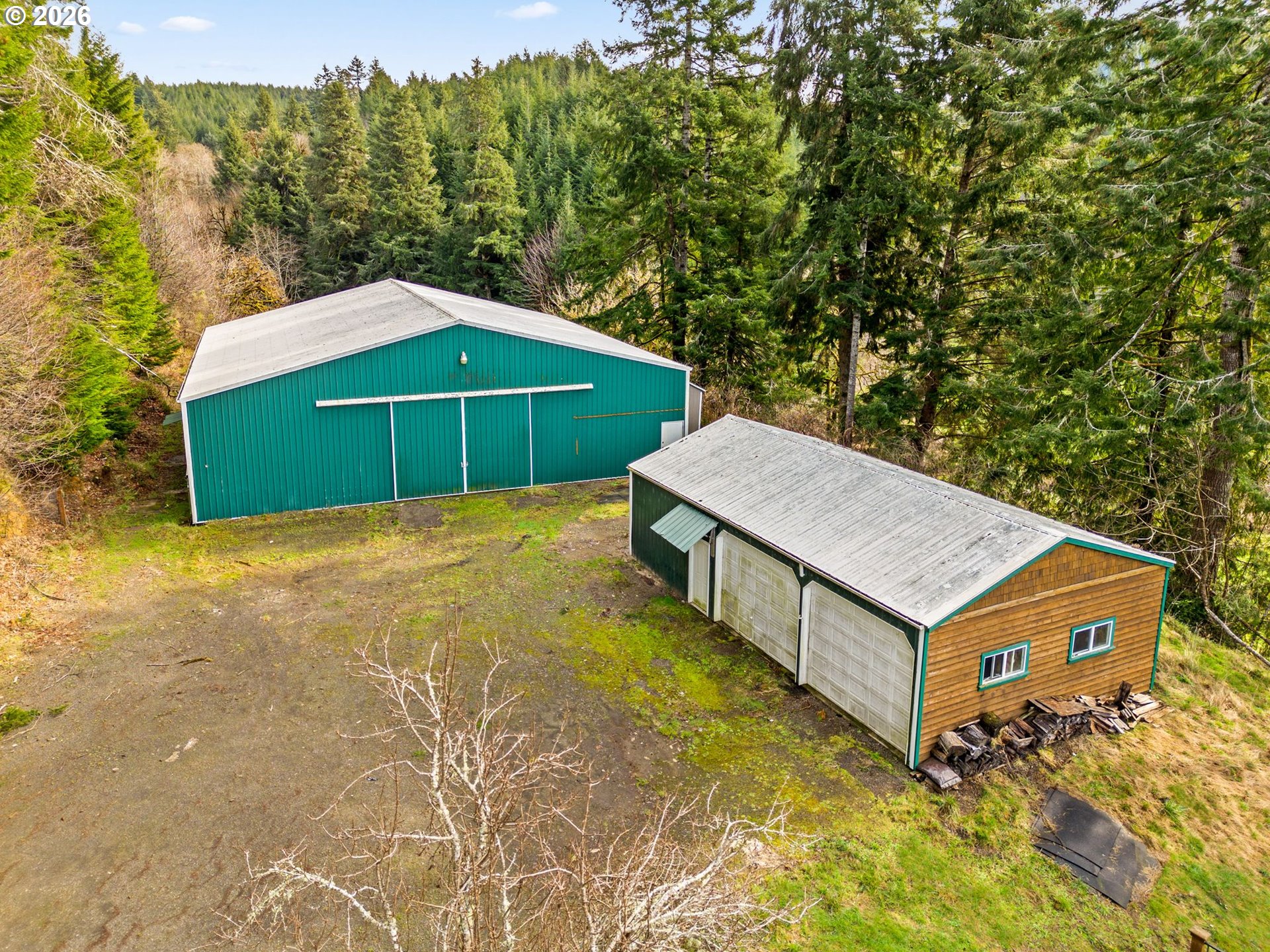 7470 Maple Creek Road Westlake, OR 97493 - Photo 26 of 33 a view of a house with a yard and sitting area