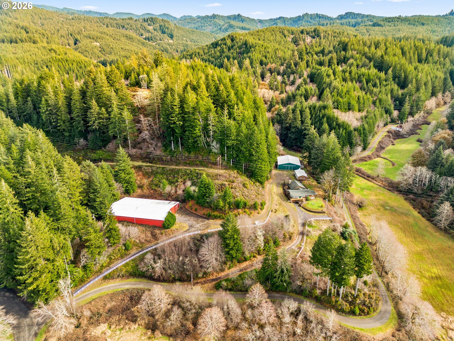 7470 Maple Creek Road Westlake, OR 97493 - Photo 3 of 33 a view of a city with mountains in the background