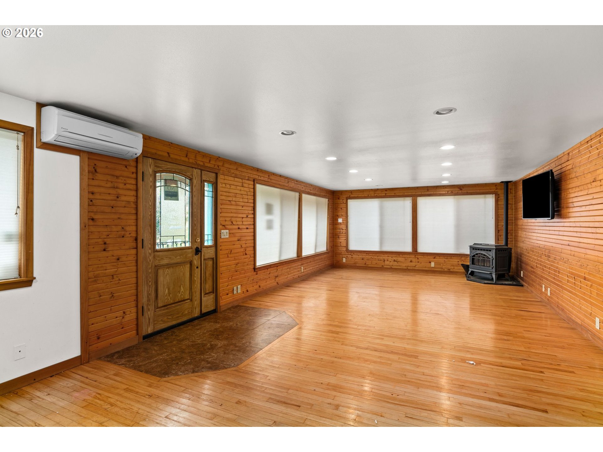 7470 Maple Creek Road Westlake, OR 97493 - Photo 9 of 33 a view of empty room with wooden floor and fan