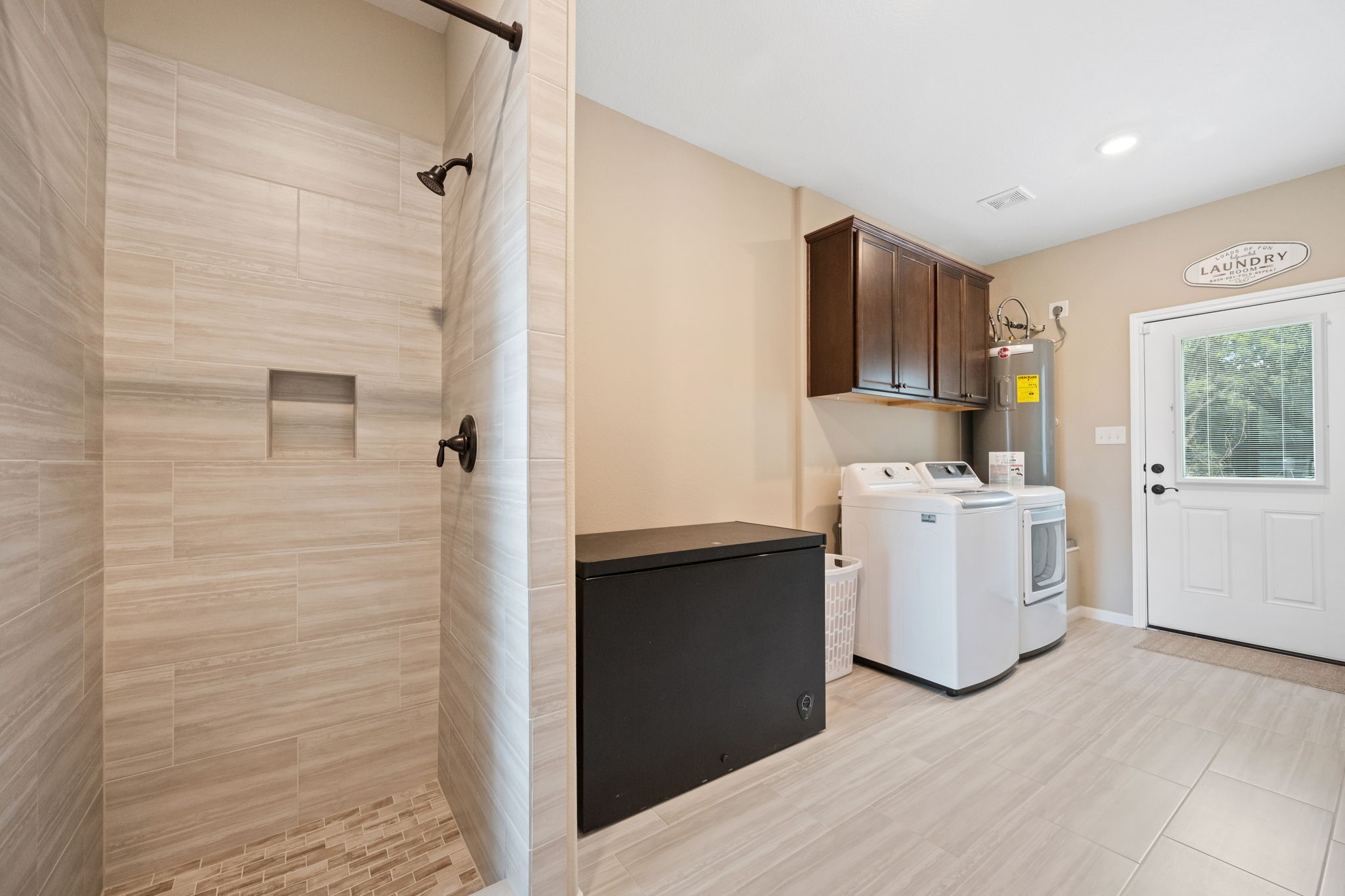 3004 Tyler Street Dayton, TX 77535 - Photo 26 of 34 a view of storage utility room and kitchen