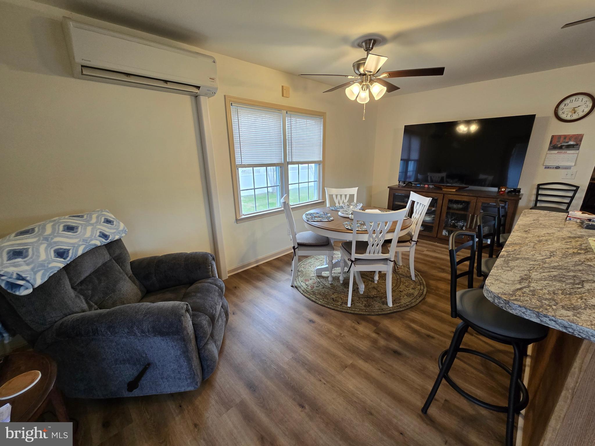 205 Myrtle Street Crisfield, MD 21817 - Photo 11 of 56 a living room with furniture and a flat screen tv