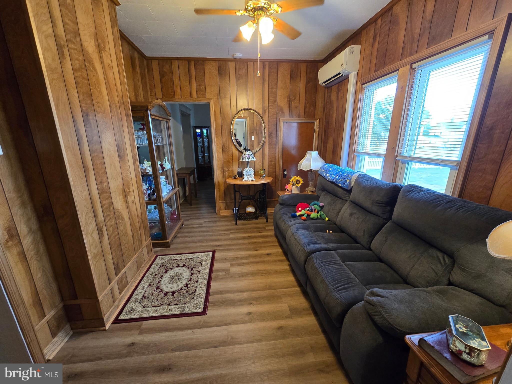 205 Myrtle Street Crisfield, MD 21817 - Photo 17 of 56 a living room with furniture and a window