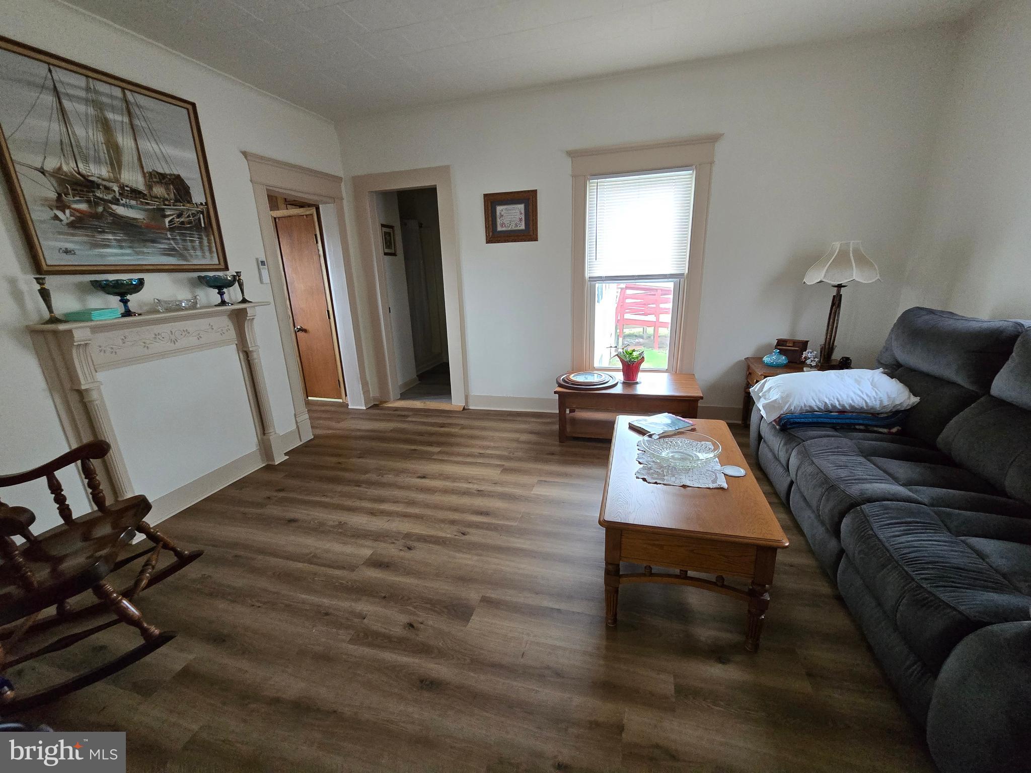 205 Myrtle Street Crisfield, MD 21817 - Photo 21 of 56 a living room with furniture and a window