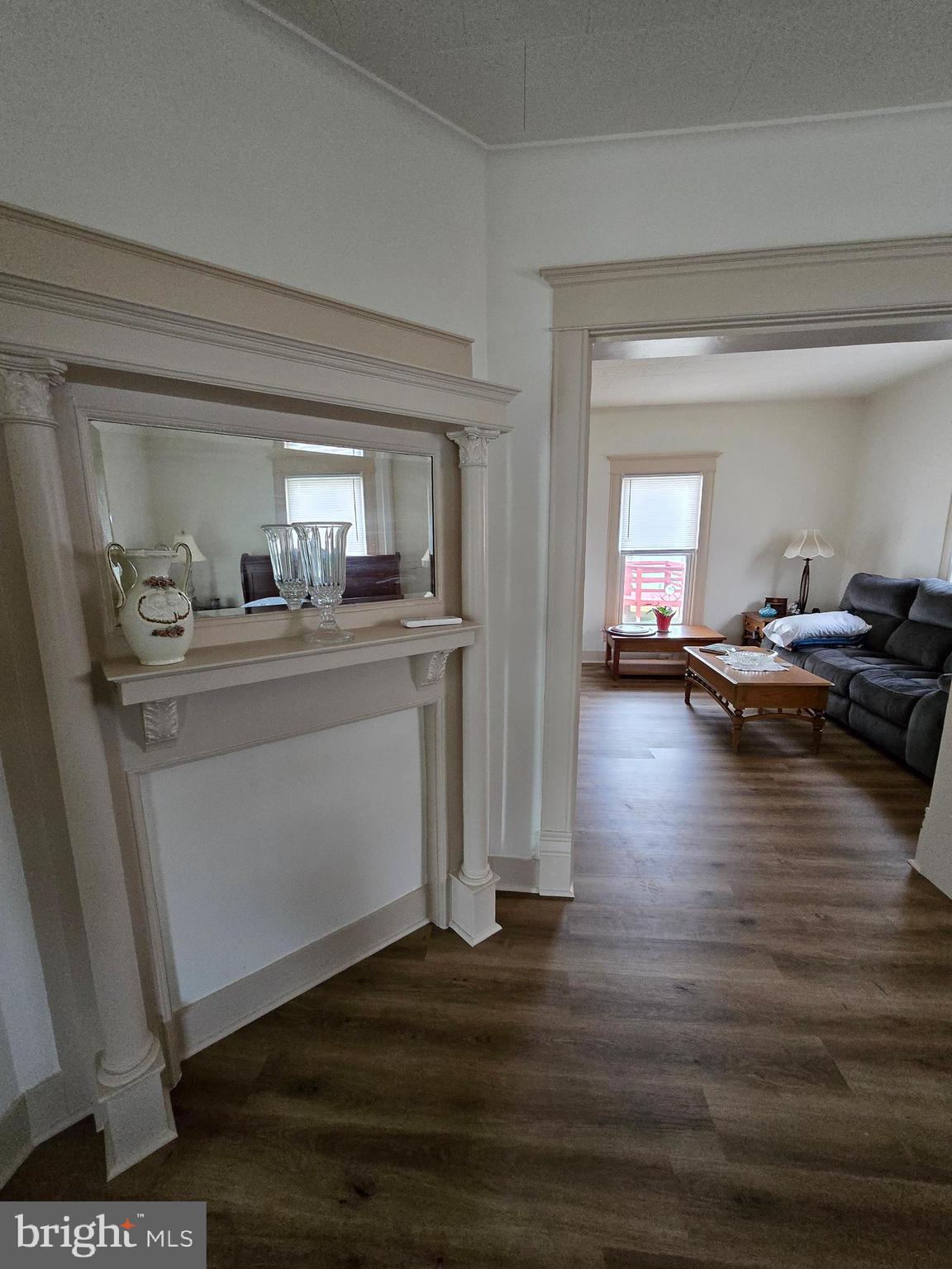 205 Myrtle Street Crisfield, MD 21817 - Photo 22 of 56 a room with furniture and a wooden floor