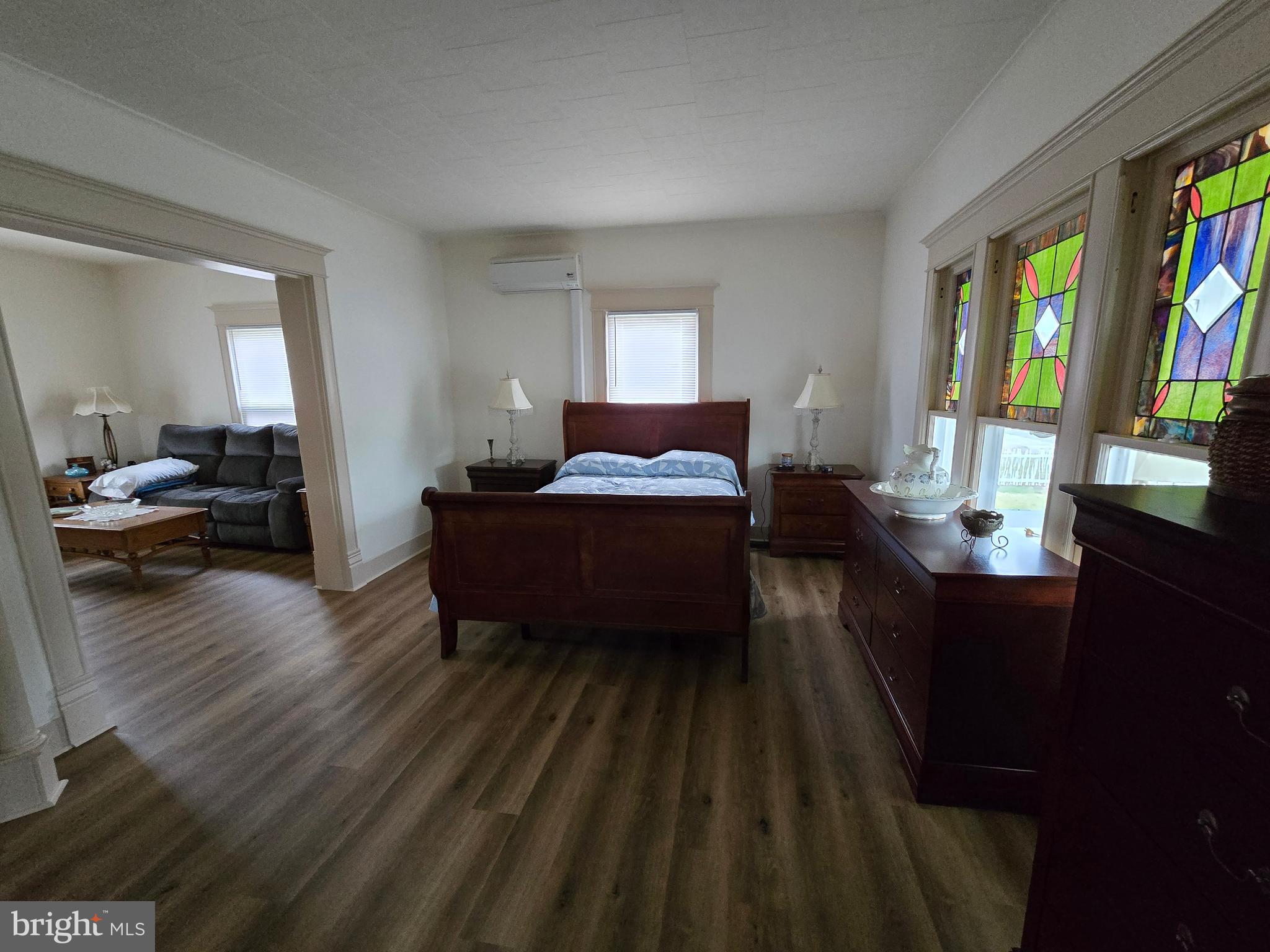205 Myrtle Street Crisfield, MD 21817 - Photo 25 of 56 a living room with a bed furniture and a window
