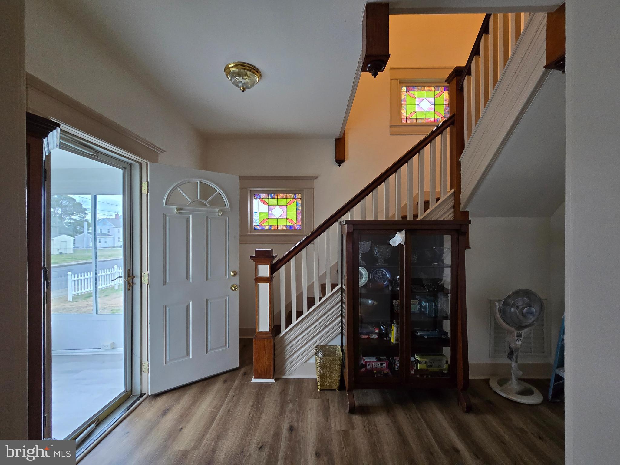 205 Myrtle Street Crisfield, MD 21817 - Photo 27 of 56 a view of entryway with wooden floor and stairs