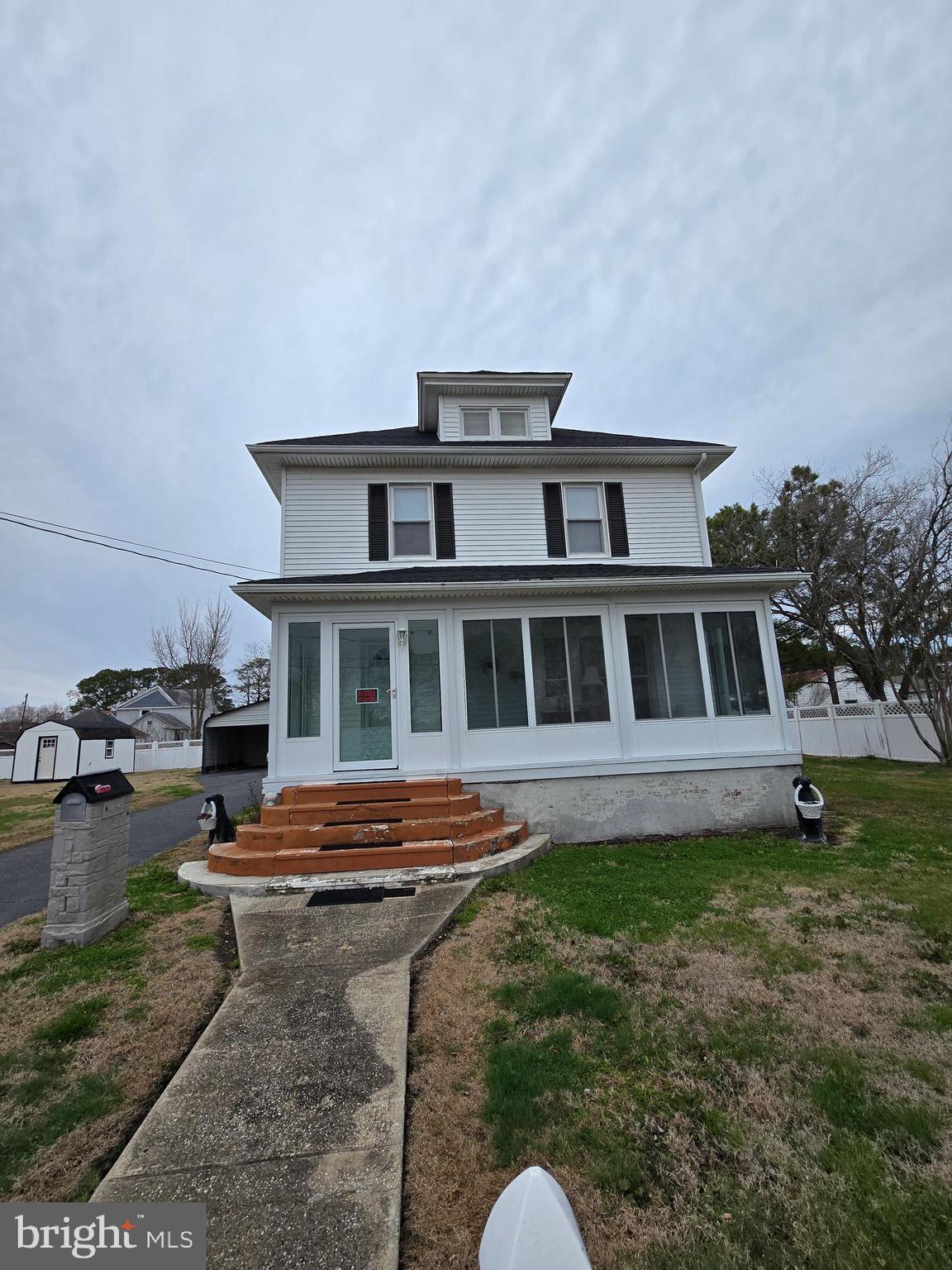 205 Myrtle Street Crisfield, MD 21817 - Photo 3 of 56 a front view of a house with a garden
