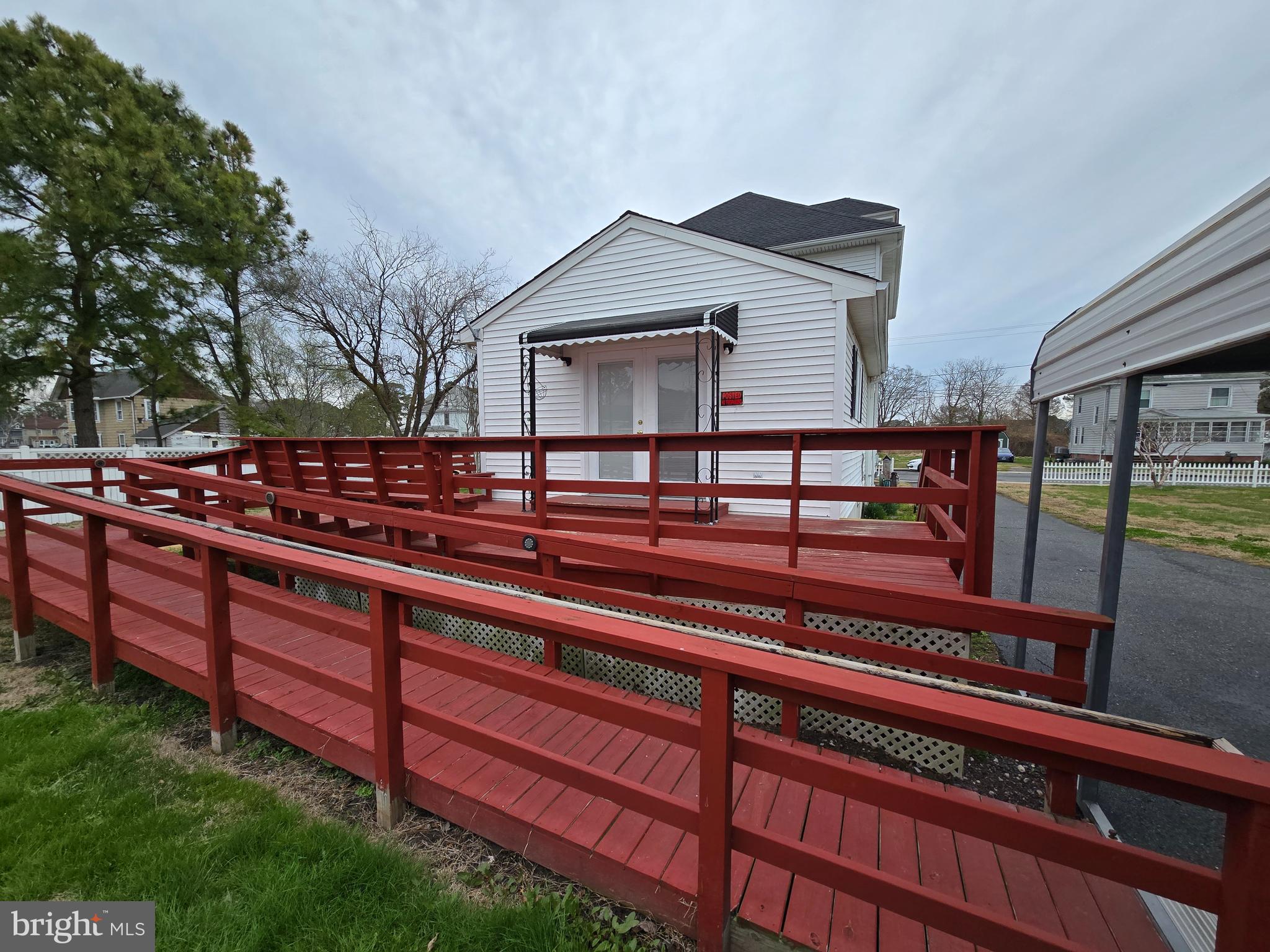 205 Myrtle Street Crisfield, MD 21817 - Photo 33 of 56 a view of a wooden bench next to a yard