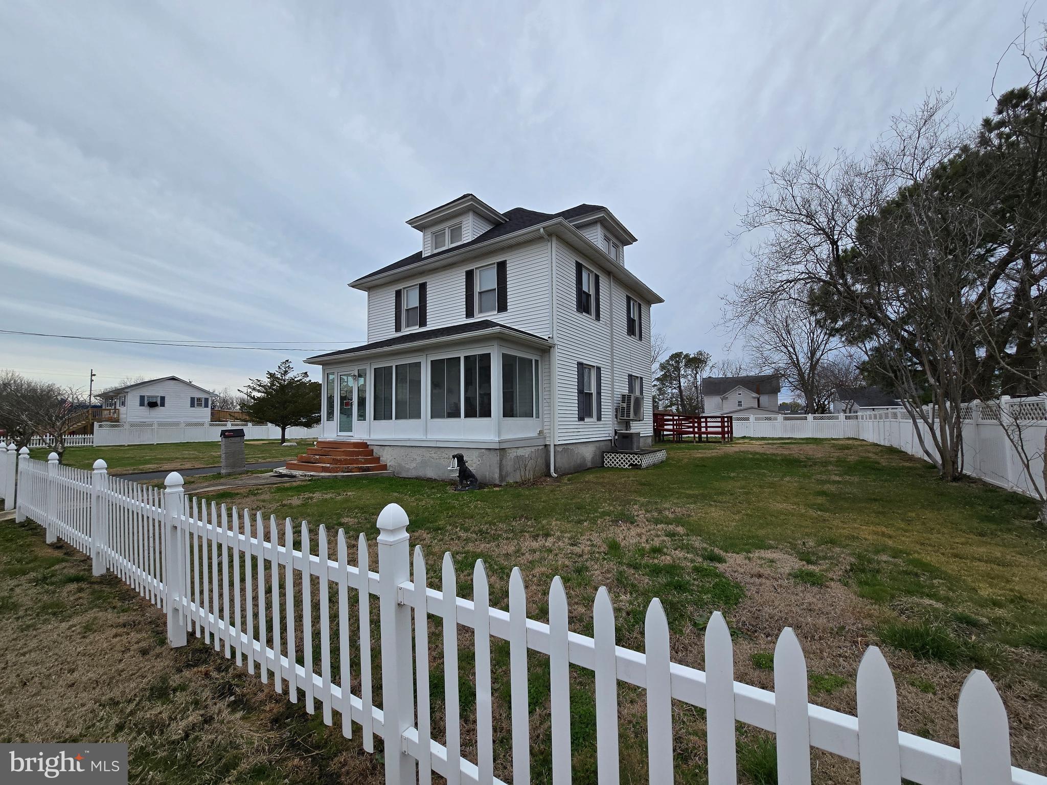 205 Myrtle Street Crisfield, MD 21817 - Photo 34 of 56 a view of a house with wooden deck and a yard