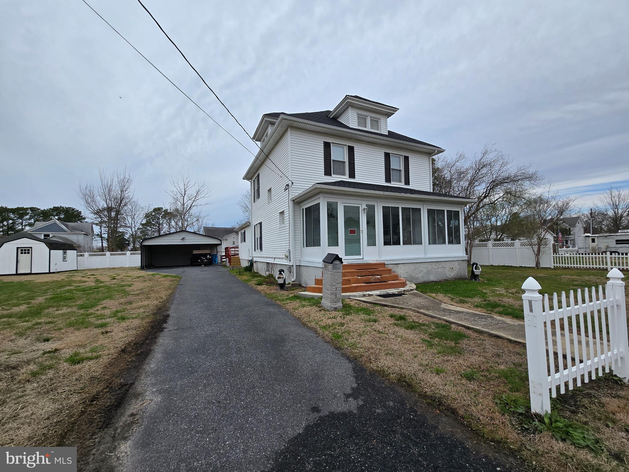 205 Myrtle Street Crisfield, MD 21817 - Photo 35 of 56 a view of a house with a yard and deck