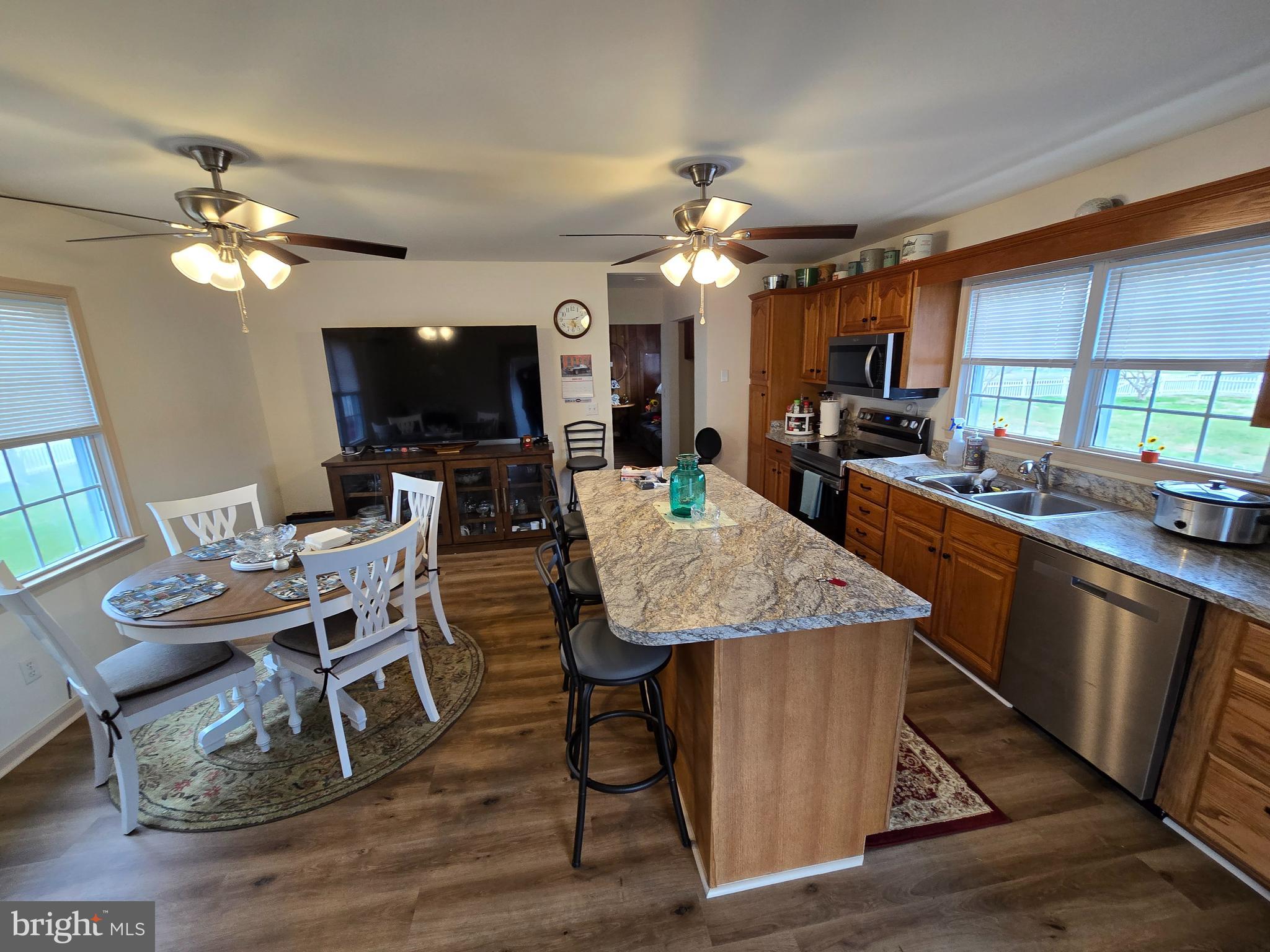205 Myrtle Street Crisfield, MD 21817 - Photo 43 of 56 a view of a dining room with furniture window and wooden floor