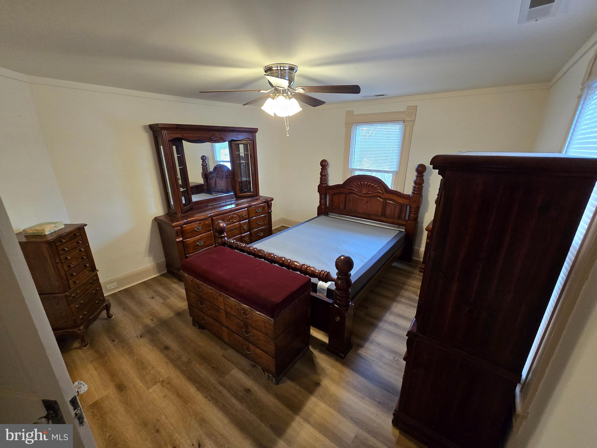 205 Myrtle Street Crisfield, MD 21817 - Photo 44 of 56 a living room with furniture and a flat screen tv