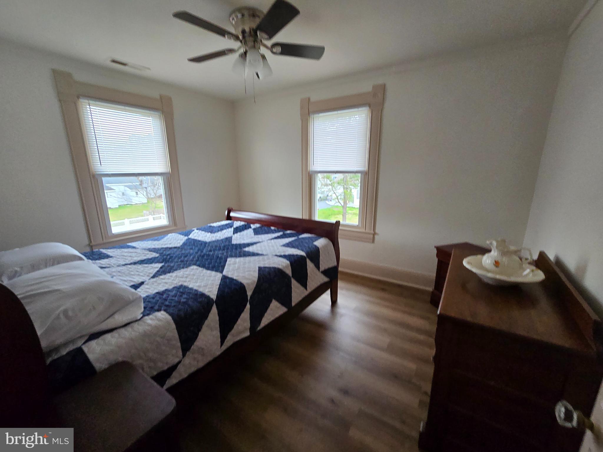 205 Myrtle Street Crisfield, MD 21817 - Photo 50 of 56 a bedroom with a bed and window