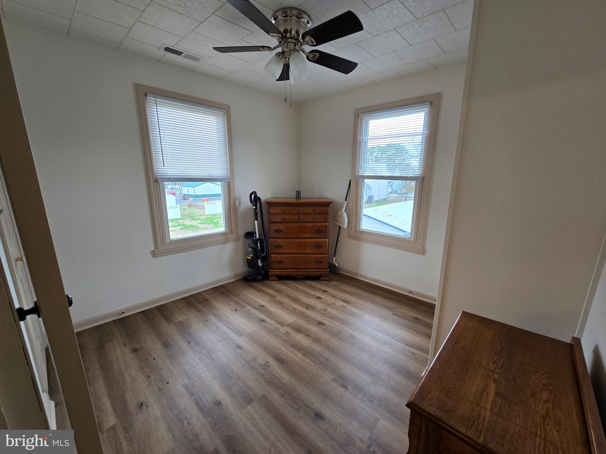 205 Myrtle Street Crisfield, MD 21817 - Photo 51 of 56 an empty room with windows and closet