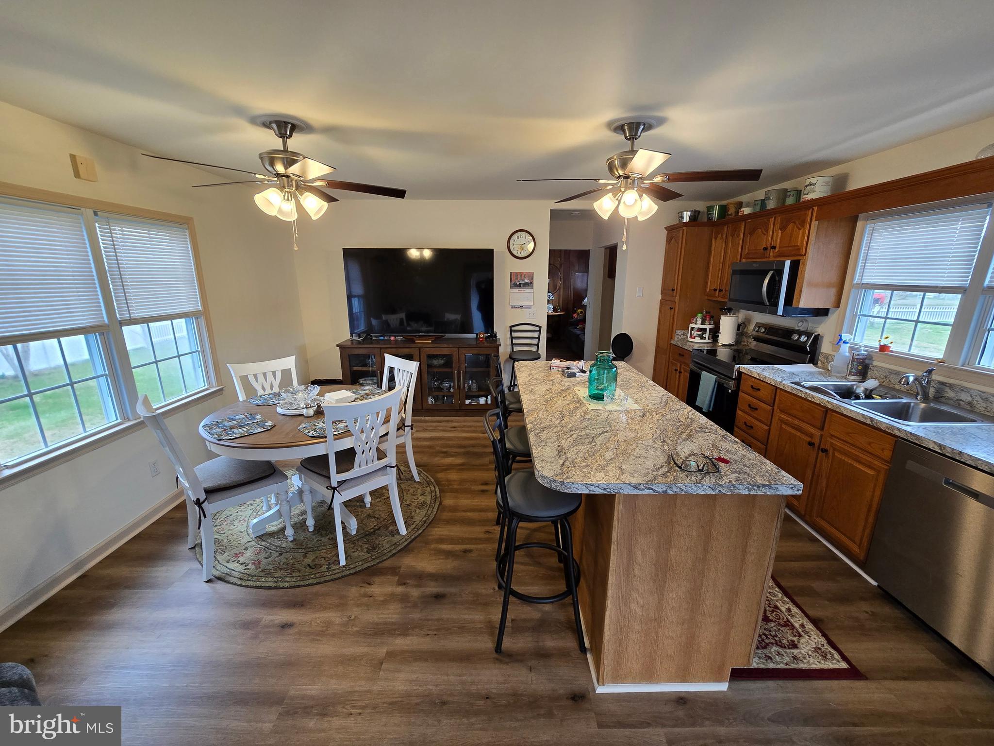 205 Myrtle Street Crisfield, MD 21817 - Photo 8 of 56 a view of a dining room with furniture a chandelier and wooden floor